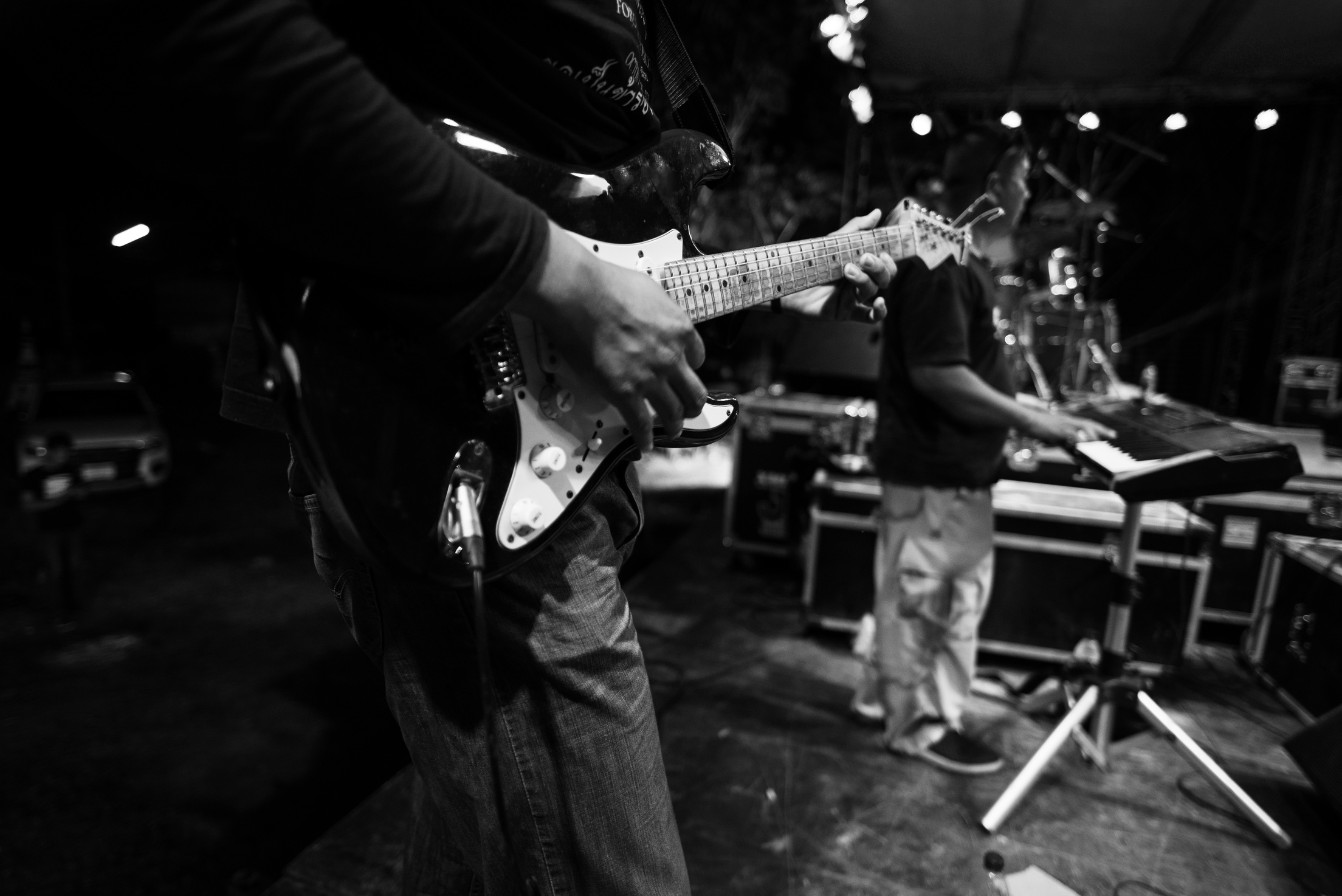 Rock Band Performs Live at Rock Show on Stage. Guitarist, Bass G